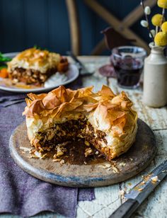 a piece of pie sitting on top of a wooden cutting board