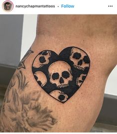 a woman's thigh with skulls in the shape of a heart