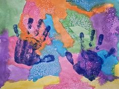 an abstract painting with different colors and patterns on it's surface, including hand prints