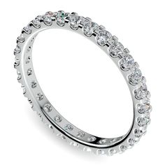 a white gold ring with rows of diamonds