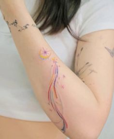 a woman with a tattoo on her arm