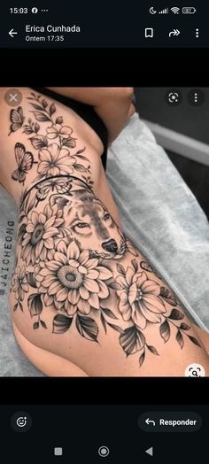 a woman's leg with flowers and butterflies on it