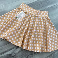 Everyone needs a little polka-dot in their lives! This beige & white polka dot spandex skater skirt is a full-circle mini skirt that will sit high on your natural waist. It is perfect for your "Minnie" costume or festival outfit. We use high quality 4-way stretch spandex and make our clothing to order in the USA. Casual Fitted Polka Dot Mini Skirt, Spring Polka Dot Mini Skirt, Fitted Polka Dot Mini Skirt, Fitted Polka Dot Mini Skirt For Spring, Polka Dot Mini Skirt For Summer, Summer Polka Dot Mini Skirt, Spring Mini Skirt In Polka Dot, Retro Polka Dot Skirt For Summer, Minnie Costume