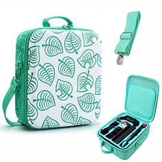 a green and white lunch box with utensils in it next to an open case