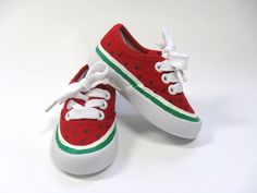 a pair of red and green shoes with white laces on the bottom, watermelon print