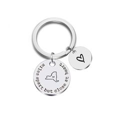 a keychain with a heart and the words, it's not easy to put