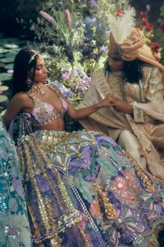 Editor's Note Featuring a purple lehenga set adorns an embroidered forest setting using glass cut crystals, gold metal embellishments, and appliqués of rich organzas and tissue. This is paired with our rose bralette embroidered in shades of multi-colour glass cut beads, with a shoulder attached delicate tulle dupatta trail embroidered in gold metal embellishments. Color: Purple Fabric: Silk, tissue organza, tulle Sleeve type: Sleeveless Neckline: Plunge Embroidery details: glass cut crystals, go Hindi Outfit, Indian Fits, Pink Bridal Lehenga, Papa Don't Preach, Purple Lehenga, Indian Dresses Traditional, Traditional Indian Outfits, Desi Clothes, Ghagra Choli