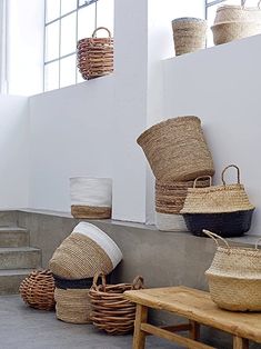 baskets and baskets are lined up against the wall