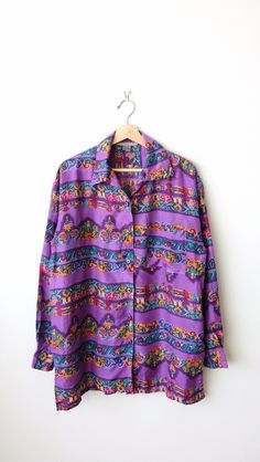 "Women's Purple/ Floral Long Sleeve Silk Blouse/Women's Silk Shirt. Measurements Length: 29 1/2\" Armpit to armpit: 22 1/2\" Shoulder: 20 1/2\"  Shoulder to end of sleeve: 22\" Condition: Gently used. There's no stains or holes. Good condition. ※Please read the policy before you purchase※" Purple Long Sleeve Relaxed Fit Blouse, Purple Relaxed Fit Long Sleeve Blouse, Purple Long Sleeve Printed Shirt, Purple Relaxed Fit Blouse For Daywear, Vintage Purple Long Sleeve Tops, Purple Long Sleeve Top For Daywear, Womens Silk Shirts, Mens Oxfords, Measurement Length