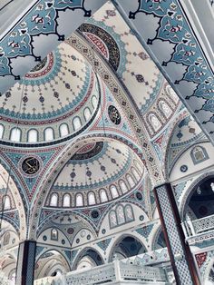 the interior of an ornate building with blue and white designs on it's walls