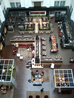 an overhead view of a restaurant with tables and chairs, couches and coffee tables