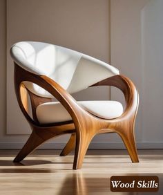 a white chair sitting on top of a hard wood floor next to a wooden wall