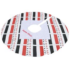 a red, black and white striped cutting board with a clock on it's side