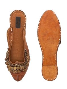 Handcrafted Pure Leather jutti with coin embellishments for your lovely foot! Double Cushioning for Extra Comfort Color: Tan Brown Fabric: Upper: Leather Insole - Leather Sole - Vegetable tanned Leather Sole Note: The product will be shipped within 20-25 days of the order placed Any slight irregularities are distinctive and are inherent to the beauty of this creation as it is precisely crafted by hands. Care intructions - Keep in dust bag, dry clean only, embellished accessory needs to be handle Bohemian Festival Flats With Handwork, Bohemian Flats With Handwork For Festival, Bohemian Slip-on Flats For Festive Occasions, Festive Bohemian Slip-on Flats, Festival Cutdana Flats, Bohemian Flats With Cutdana, Bohemian Flats With Zari Work, Transitional Bohemian Flats, Hands Care