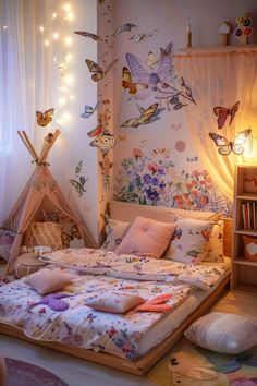 a child's bedroom decorated in pink, purple and white with butterflies on the wall