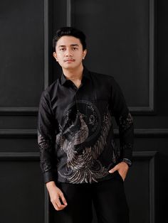 Origin: 🇮🇩 *Indonesia* Design: 🎨 *Batik* Material: ✨ *Japanese Satin Cotton* *Description:*   This batik shirt seamlessly combines luxury and comfort in one design. Wear it with pride and showcase the charm of Indonesian culture in your style. Perfect for formal events, business meetings, or daily wear. *Model Size:*   📏 *Height:* 175 cm   ⚖️ *Weight:* 75 kg   📐 *Size:* L *Product Specifications:* - *Primary Color:* Dominantly Black with Yellow and Gray accents - *Main Fabric:* Japanese Sat Casual Black Shirt With Batik Print, Traditional Black Shirt With Batik Print, Black Long Sleeve Shirt With Batik Print, Batik Fashion Man, Batik Shirt Men, Batik Danar Hadi, Black Long Sleeve Batik Print Shirt, Batik Shirt, Batik Pattern