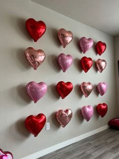 heart shaped balloons are hung on the wall