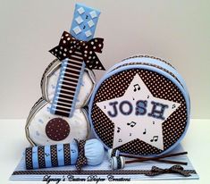 a snowman with a name on it sitting next to a small blue and white decoration