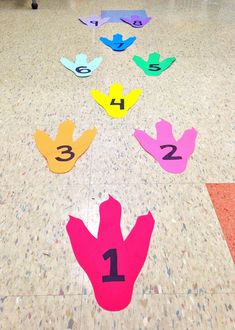 the numbers are arranged on the floor in order to make it look like they have hands