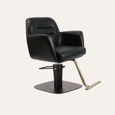 a black chair sitting on top of a metal pedestal