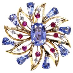 Beautifully designed and masterfully handcrafted by the renown American jeweler Oscar Heyman, this 18 karat Retro brooch is a stunning piece of vintage jewelry from the 1950s. Set with perfectly matched pastel blue natural sapphires, vibrant red rubies and bright lively diamonds which bring a wonderful contrast of colors to this impressive jewel, in a star shaped design. The central oval sapphire has been measured to weigh approximately 10 carats. Retro Jewelry Vintage, Bleu Pastel, Gold Brooch, Antique Brooches, Retro Jewelry, Pin Pendant, Gold Brooches, Ruby Diamond, Fantasy Jewelry