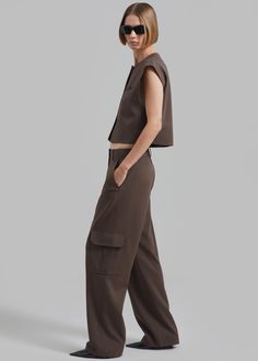 Color: Brown Midweight woven fabric Relaxed fit Straight leg Enlarged cargo pockets at the leg Side seam pockets Back illusion welt pockets Belt loops Zip fly Hook and bar closure Unlined 69% Polyester 29% Rayon 2% Elastane Dry Clean By The Frankie Shop. Imported