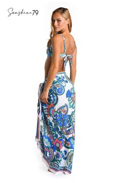 This pareo by Sunshine 79 features an elegant white and blue multicolored paisley print, exuding a blend of sophistication and playfulness. Its intricate pattern adds a touch of bohemian charm to your poolside style. This gorgeous pareo looks equally beautiful with a one-piece suit as it does a bikini top and bottoms. The sarong-style fit that ties at the side lends a chic silhouette. [split] Details Pareo cover up Adjustable side tie with tassels One size fits all Fabric 100% Rayon Crepe Sarong Style, Poolside Style, Poolside Fashion, Swimsuit Material, One Piece Suit, Sun Tan, Swimwear Collection, Sarong, Paisley Print