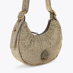 This Small Puff Kensington purse is crafted in a beige houndstooth fabric with large gold crystals across the exterior. There is a large antiqued brass eagle head with crystals sat on the front complimenting the two buckles on either side of the shoulder strap.5.5in (H), 10.2in (L), 3.1in (D)Strap length: 21.6inPadded shoulder strapCan fit phones up to 7inchesInterior: Monogrammed interior liningExterior: FabricStyle number: 2711440609 Designer Gold Bags With Rhinestones, Luxury Rhinestone Shoulder Bag For Everyday Use, Luxury Gold Shoulder Bag With Rhinestones, Micro Bags, Houndstooth Fabric, Gold Crystals, Swimming Bag, Eagle Head, Shop Shoes