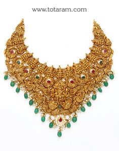 22 Karat Gold "Lakshmi - Peacock" Necklace with Cz, Color Stones, Pearls & Beads (Temple Jewellery)

Enhance Your Beauty with Exquisite 22 Karat Gold "Lakshmi - Peacock" Necklace  Indulge in the timeless elegance of Indian craftsmanship with this stunning 22 Karat Gold "Lakshmi - Peacock" Necklace from Totaram Jewelers. Adorned with shimmering CZ, vibrant Color Stones, lustrous Pearls, and intricate Beads, this piece of Temple Jewellery is a true masterpiece that will make you stand out from the Luxury Multicolor Temple Necklace With Cutdana, Luxury Multicolor Tilla Temple Necklace, Luxury Green Temple Necklace For Celebrations, Luxury Temple Necklace For Puja, Luxury Gold Temple Necklace With Peacock Design, Luxury Multicolor Temple Necklace For Women, Luxury Green Temple Jewelry Chandbalis, 22 Carat Gold Jewellery, Indian Choker