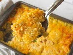 a spoon with some food on it in a pan