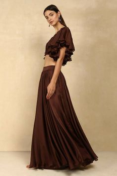 Colour : BrownFabric : Chiffon Skirt Details: Gathered Waist, Satin Lining, Side Zip & Hook closure.Care• Dry Clean Only• Do Not Bleach• Steam Iron Only THE MEASUREMENTS ARE IN INCHES Shoulder Bust Waist Low Waist Hips Armhole Extra Small 14 34 27 29 38 14 Small 14.5 36 29 31 40 15.5 Medium 15 38 31 33 42 16.5 Large 15.5 40 33 35 44 17.5 XL 16 42 35 37 46 18.5 XXL 17 44 37 39 48 19.5 This item is Made-To-Order. Please allow up to 21 working days for us to make your bespoke design. Disclaimer - “ Silk Ruffled Flowy Skirt, Long Silk Skirt With Ruffles, Silk Tiered Skirt Bottoms With Ruffles, Bohemian Flowy Bottoms For Party, Flowy Wide Leg Skirt With Ruffles, Floor-length Ruffled Flowy Skirt, Floor-length Flowy Ruffled Skirt, Floor-length Ruffled Skirt, Brown Party Bottoms With Flowy Fit