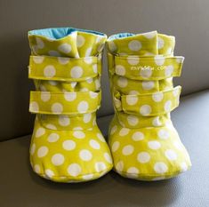 a pair of yellow and white polka dot boots