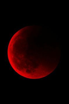 the red moon is seen in the dark sky