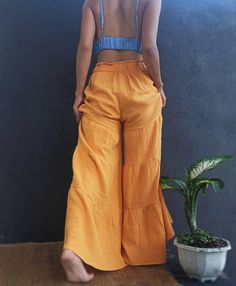 Bohemian Summer Pants In Solid Color, Casual Ruffled Trousers, Bohemian Summer Pants, Flared Solid Bottoms For Summer, Flare Bottoms In Solid Color For Summer, Solid Flare Bottoms For Summer, Summer Wide-leg Pants With Ruffles, Casual Ruffled Relaxed Fit Pants, Casual Wide-leg Pants With Ruffles