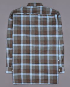 The French Crown checkered overshirt is a stylish and versatile piece of clothing that provides both comfort and functionality, crafted from high-quality materials that make it ideal for layering on cooler days. Its timeless plaid checkered design with flap pockets and zipper closure is understated and classic, making it easy to pair with a wide range of outfits. So layer it over a stylish tee with jeans and sneakers and you are all set to head out! Fused collar and cuffs, collar stand and flat Checker Design, Checkered Design, Of Outfits, Blue Check, Carolina Blue, Collar And Cuff, Blue Plaid, Full Sleeve, Piece Of Clothing