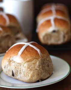 hot cross buns with icing on a plate