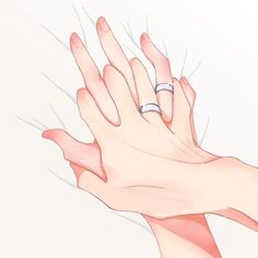 two hands reaching for each other with their wedding rings on top of one another's fingers