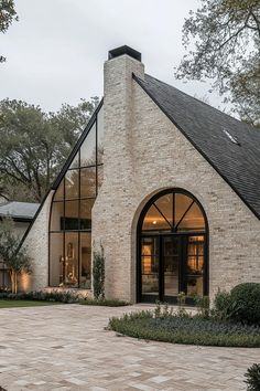 a large brick house with an arched window