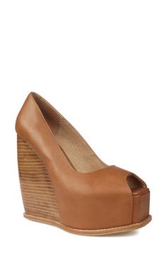 A squared-off peep toe amps up the trendsetting appeal of a lofty sandal set on a chunky platform and stacked wedge heel. 5 1/2" heel; 1 1/2" platform Leather or genuine-calf-hair upper/leather lining and sole Imported Brown Wedge Sandals With Padded Heel, Leather Chunky Platform Wedge Heels, Brown Platform Wedge Heels, Brown Platform Heels With Wedge Heel, Chunky Platform, Calf Hair, Platform Wedge Sandals, Platform Wedges, Wedge Heels