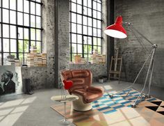 a living room filled with furniture and a red lamp on top of a table next to a window