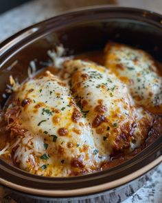 a close up of some food in a bowl on a table with a napkin and fork