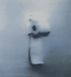 a blurry image of a person standing in the fog