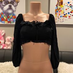 Size Small Brand New, Never Worn. This Top Is So Flattering, Really Great With High Rise Ripped Jeans. Super Soft, Comfortable And Smocked. Can Be Worn On Or Off The Shoulders! Perfect For Spring And Summer All Offers Accepted Or Countered W. Lowest All Items Are Brand New And Unused Unless Stated Otherwise. Black Cropped Ruffle Crop Top, Black Ruffled Crop Top, Fitted Smocked Top With Smocked Back For Party, Fitted Smocked Top For Party, Black Cropped Tops With Smocked Back, Chic Smocked Ruffle Crop Top, Black Ruffled Crop Top For Night Out, Black Cropped Ruched Top, Black Long Sleeve Top With Smocked Bodice