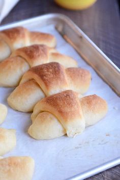 rolls are on a baking sheet ready to go into the oven or bake in the oven