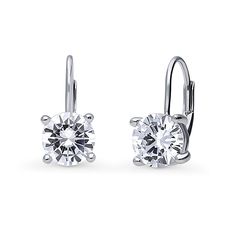 These solitaire dangle earrings flaunt a simple elegance with a lustrous brilliance. Crafted with fine 925 sterling silver, rhodium plated, nickel free. The dazzling solitaire stones feature premium grade 2.5 carat total (1.25ct per earring) round cubic zirconia CZ (7mm) in prong setting. Leverbacks. Measures 0.61"(L), 0.28"(W). Get the look of celebrity inspired jewelry. BERRICLE Cubic Zirconia (simulated diamond) jewelry are made with flawless high quality CZ stones. Individual stone is carefu Leverback Earrings, Accessories Jewelry Earrings, Simple Elegance, Round Earrings, Cz Stone, Real Diamonds, Rhodium Plated, Prong Setting, Fashion Earrings