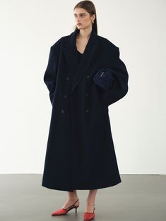 (Pre-order) Expected Delivery : We ensure delivery within 3 weeks from your order date 90% Polyester 10% Wool Lining: 100% polyester Mid-weight bonded wool-blend unisex coat in a super oversized silhouette for a contemporary context. The long peak lapel neckline and double-breasted fastening complement the built-in stiff shoulder pads. A lower back vent for comfort wear and slip pockets for practicality. Fully lined. By SourceUnknown. Imported Model Is 5'8" (178cm) Wearing size L S: Overall Leng Oversized Structured Wool Outerwear, Modern Oversized Wool Coat, Oversized Wool Pea Coat, Oversized Structured Wool Coat For Winter, Modern Oversized Wool Pea Coat, Modern Oversized Long Wool Coat, Modern Oversized Winter Pea Coat, Modern Oversized Pea Coat For Workwear, Modern Oversized Pea Coat For Winter