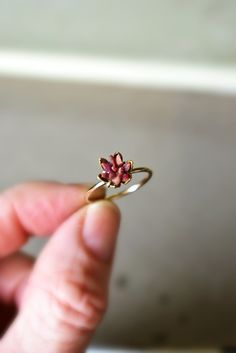 Unique raw Ruby ring in 14K yellow gold fill. My bestselling lotus ring design, now in yellow gold or fill! A handcrafted 14K gold fill band with my etched cup filled with raw Ruby chips in a mosaic pattern, my signature design. Organic, natural ruby reds in varying shades look pretty and unique next to the yellow gold color. Ruby is July's birthstone. Made to order, to size. Scroll to read all the details. I love this ring as sparkly, any occasion present for her, Women's July birthstone gift f 14k Gold Flower Ring With Gemstone, Spiritual Yellow Gold Stackable Rings For Wedding, Yellow Gold Stackable Wedding Rings, 14k Gold Gemstone Flower Ring For Anniversary, Spiritual Gold Birthstone Ring For Wedding, Handmade 14k Gold Flower Ring, 14k Gold Flower Ring With Gemstones As A Gift, 14k Gold Flower Shaped Gemstone Rings, Gift 14k Gold Flower Ring With Gemstones