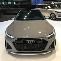 an audi car is on display in a showroom