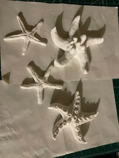 three starfishs and an octopus are made out of paper