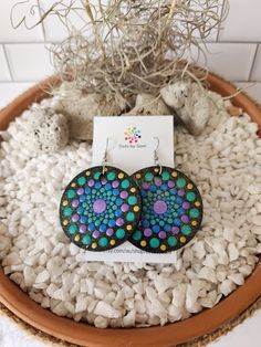 These unique wooden mandala earrings are a stunning piece of wearable art that will make a great addition to your accessory collection! Dress them up or wear them casually either way they are sure to suit every occasion. The wooden discs are hand painted dot by dot and sealed for shine and protection and they are light weight which makes them very comfortable to wear! The hand painted discs come on a surgical steel shepherd hook style earrings The total drop of earring is approx 7cm with each disc measuring 5cm. If you love this design but would like it in a different colour please feel free to message me and I will be more than happy to chat with you about creating something for you. Note: *This is a loving handmade piece and is classed as costume jewellery, It should be handled with care Painted Discs, Dot By Dot, Happy Rock, Mandala Earrings, Main Point, Shepherds Hook, Hand Painted Earrings, Painted Earrings, Dot Art